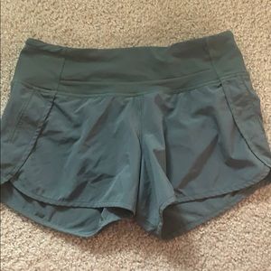 Army green Lululemon shorts.